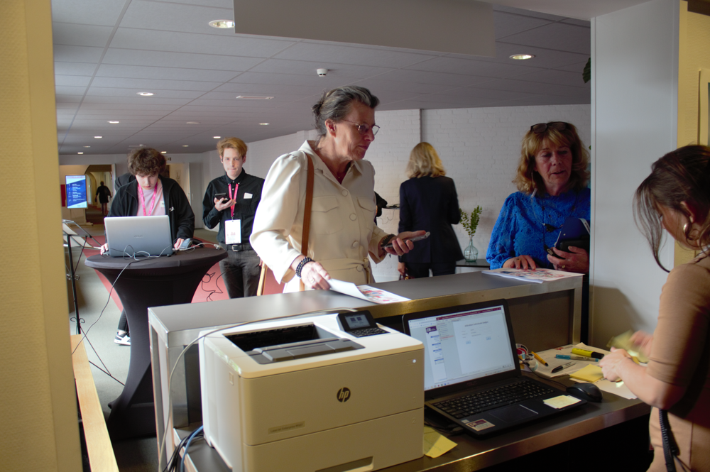 Festival guests check in at the registration desk.